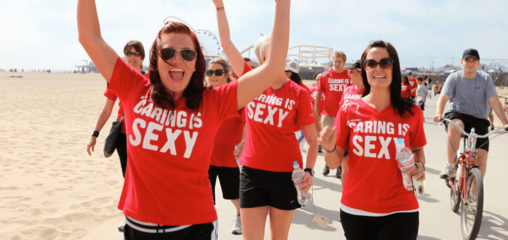 group of volunteers smiling at the beach