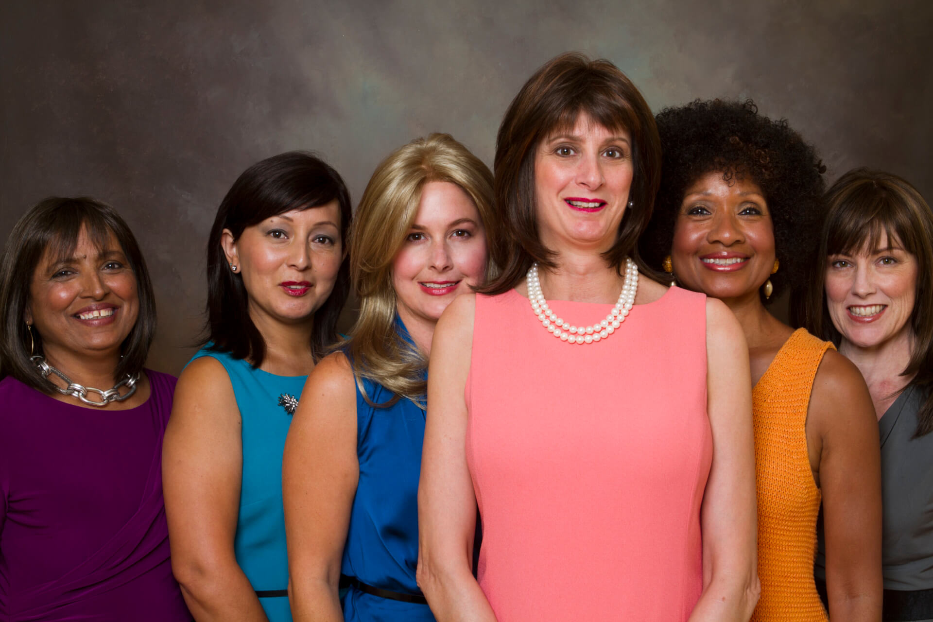 group of different woman smiling